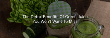 Glass jars of fresh green juice with leafy greens and cucumbers on a wooden table, featuring the text “The Detox Benefits Of Green Juice You Won’t Want To Miss”