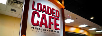 Loaded Cafe restaurant sign reading “LOADED CAFE” with “Pancakes • Burgers” and “Santa Ana - Harbor” below.